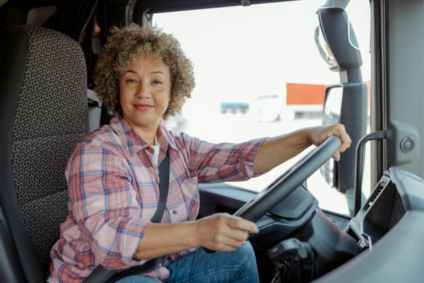 istock Female Truck Driver Looking at Camera 1632195764