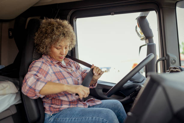 istock Female Lorry Driver Fastening Her Seatbelt 1632195775