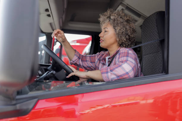 istock Female Truck Driver Having Problems on Road 1632196488