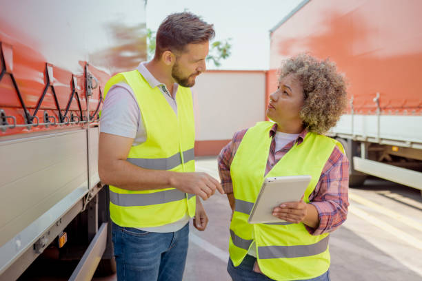 istock Lorry Driver Controlling Truck Driver Schedule With Digital Tablet 1632197109