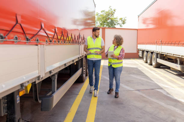 istock Lorry Driver Controlling Truck Driver Schedule With Digital Tablet 1632197258
