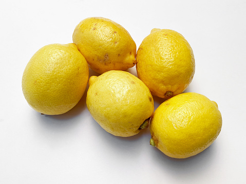 Group of whole lemons on white background