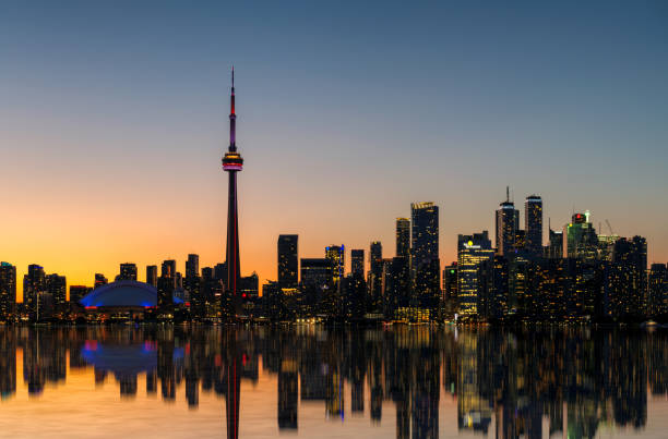 istock Toronto skyline with reflection in lake at night in Toronto, Canada 1632197609