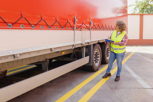 Dispatcher Going Through Checklist on Parking Lot