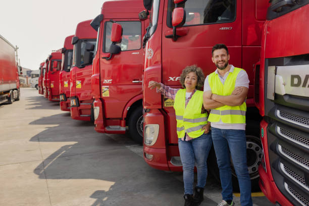 istock Two Professional Truck Drivers Looking at Camera 1632197783