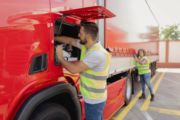 istock Truck Drivers Colleagues Preparing a Truck 1632197788