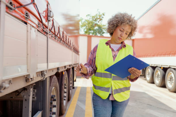 istock Dispatcher Going Through Checklist on Parking Lot 1632198418
