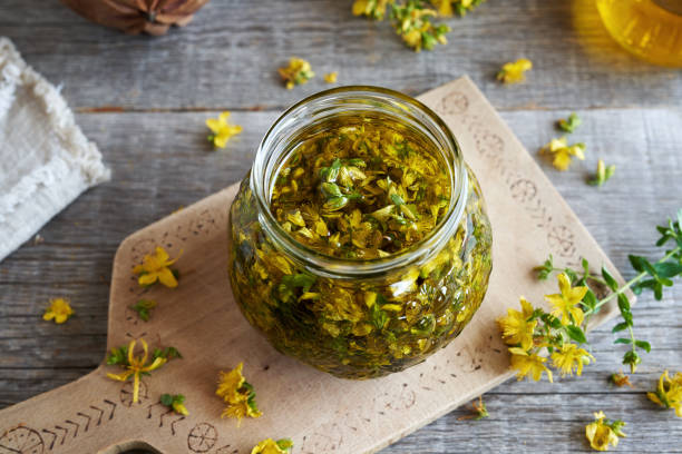 istock Macerating fresh St. John's wort blossoms in oil 1632214221