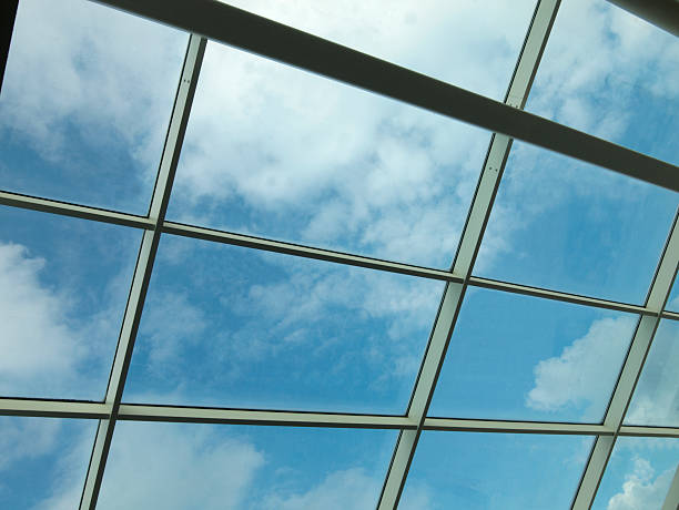 istock Sky and clouds through glass roof 163221548