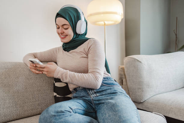 istock A young Asian woman using her phone at home 1632217300