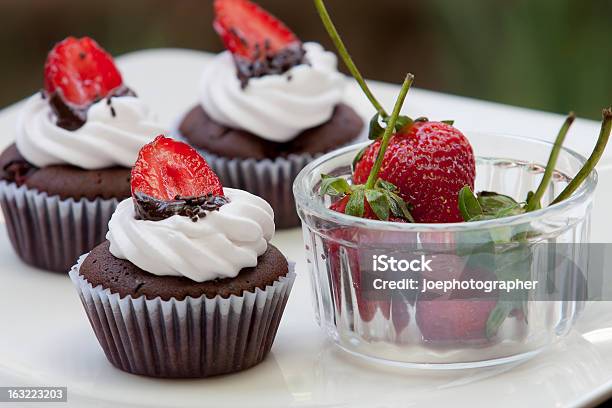 Chocolate Cupcake With Strawberry On White Dish Stock Photo - Download Image Now - Baked, Bakery, Brown