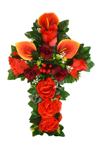 istock Funeral flower cross tribute isolated on white background 1632255603