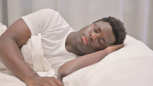 istock African American Man Sleeping in Bed on Side 1632258803