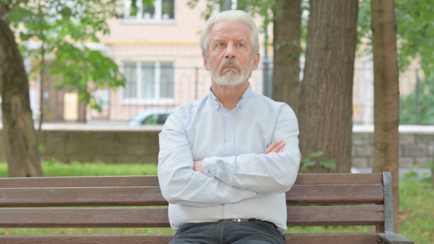 istock Brainstorming Senior Old Man Thinking while Sitting Outdoor 1632261372
