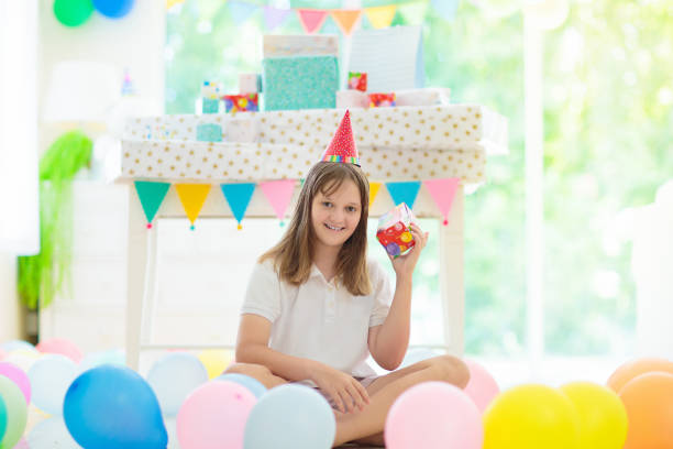 istock Kids birthday party. Child opening present. 1632282117