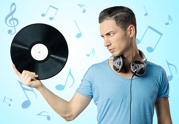 istock Young male holding black vinyl in hand 163229884