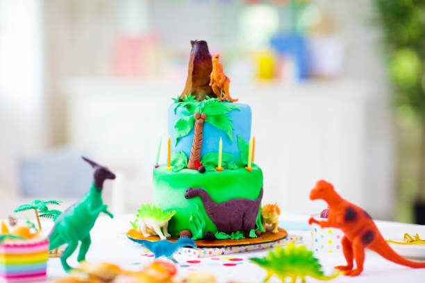 istock Kids birthday party. Dinosaur theme cake. 1632301165