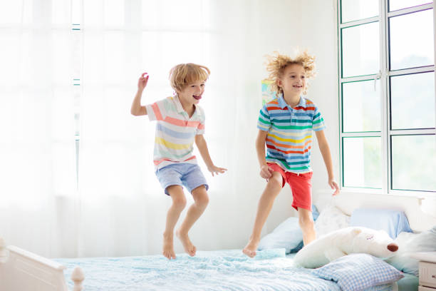 istock Child playing in bed. Kids room. Boy at home. 1632303857