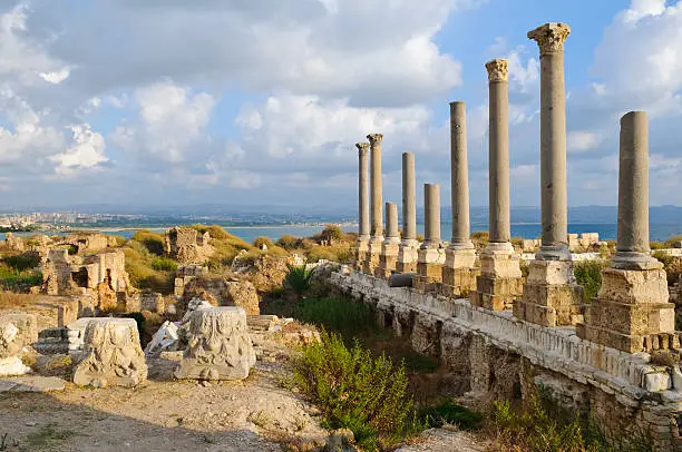 Roman ruins in Tyre, Lebanon, the modern city in the background to the left