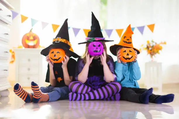 Photo of Kids in witch costume on Halloween trick or treat