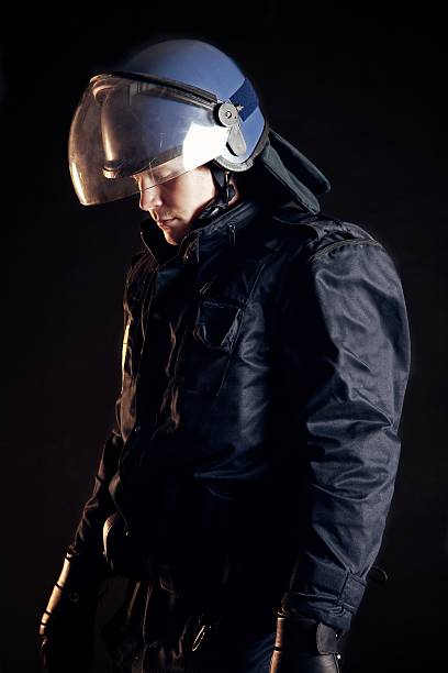 istock Police Officer Wearing Protective Uniform 163232226