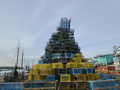 Lunenburg, NS, CAN, 12.31.2022 - A Christmas tree made of lobster traps piled high into the sky.