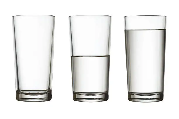 Photo of tall empty, half and full glass of water isolated