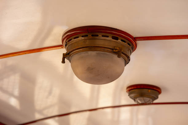 istock Two old lamps on the ceiling of a train car 1632343065