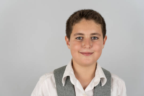 Christian boy with hands clasped.
