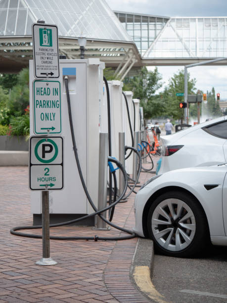 istock Electric vehicles lined up waiting to be charged 1632356219