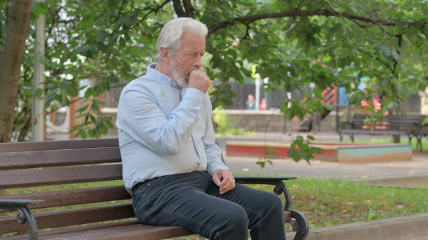 istock Coughing Senior Old Man Sitting Outdoor 1632361506