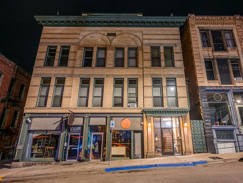 Night view of a historic brick building in downtown Butte, Montana, United States