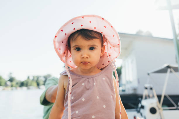 Kid summer panama in hand on white background isolation