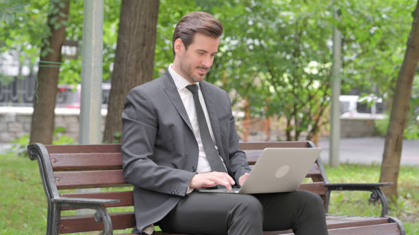 istock Young Businessman Working on Laptop Outdoor 1632412691
