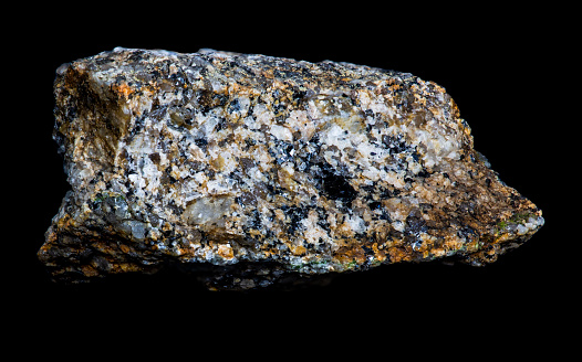 macro photography of natural mineral from geological collection - raw green aventurine stone on white background