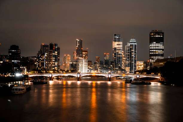 Night view from Westminster Bridge to illuminated Vauxhall.