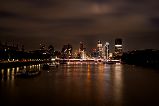 Night view from Westminster Bridge to illuminated Vauxhall.