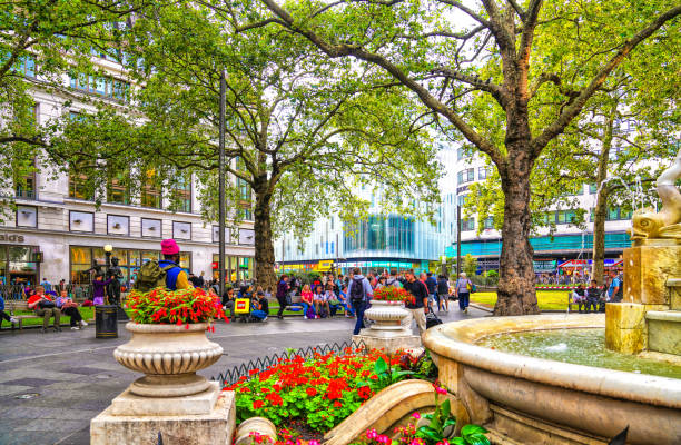 Leicester Square stock photo. Leicester Square is a pedestrianised square in the West End of London, England. It was laid out in 1670 as Leicester Fields, which was named after the recently built Leicester House, itself named after Robert Sidney, 2nd Earl of Leicester.