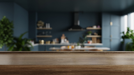 Wooden table top on blur kitchen room background,Modern kitchen room interior.3d rendering
