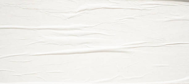 istock White blank crumpled and creased paper poster texture background 1632525128