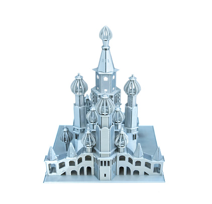 3D printer machine printing plastic model of castle isolated on white