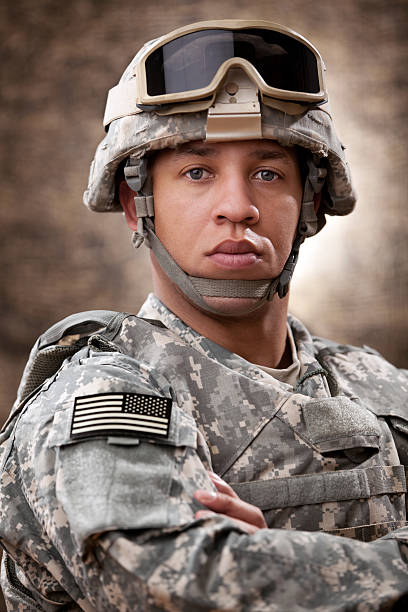 American Soldier Portrait American soldier portrait. The model is wearing an official US army camouflage uniform or ACU and combat helmet and body armor. black military man stock pictures, royalty-free photos & images