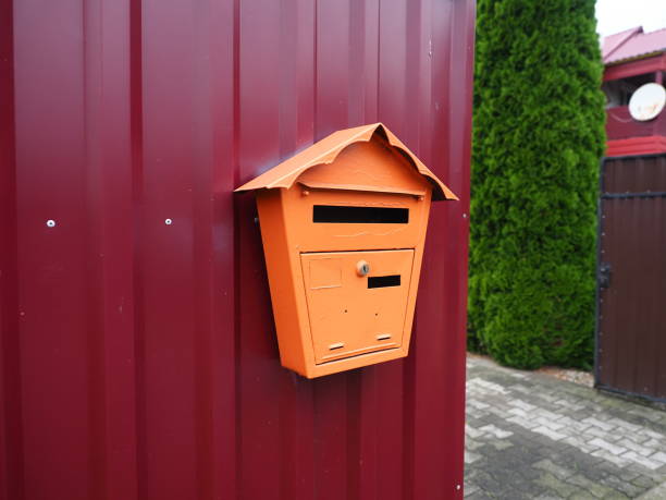 istock Mailbox on the red metal wall. Mailbox for correspondence. 1632581102