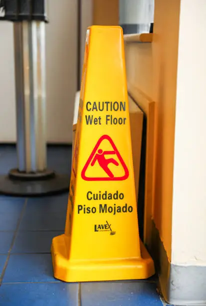 Photo of Yellow caution sign: Symbol of warning and alertness; vibrant hue signifies potential hazards, urging vigilance in surroundings