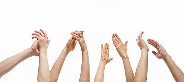Group of hands applauding on white background