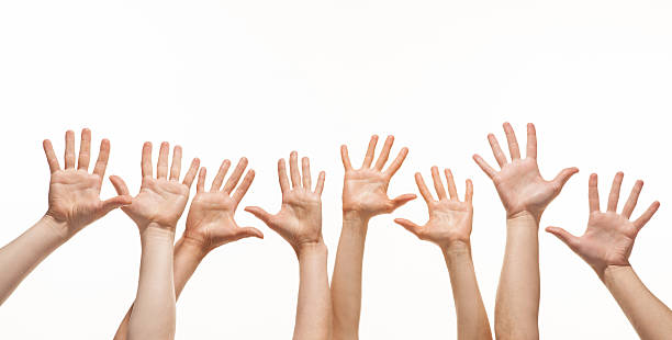 istock Many hands reaching out in the air 163259033