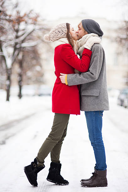 Young couple kissing on winter day