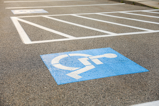 Symbolic blue and white wheelchair logo: Inclusive accessibility, equal rights, special needs, societal inclusion