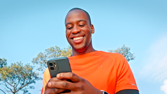 Fitness man, phone and outdoor communication, social media and funny chat in forest for exercise or workout. Athlete or african person typing or search on mobile for training results in nature