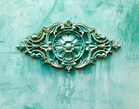 Crémieu, France: Beautiful Floral Detail on Old Turquoise Metal Door